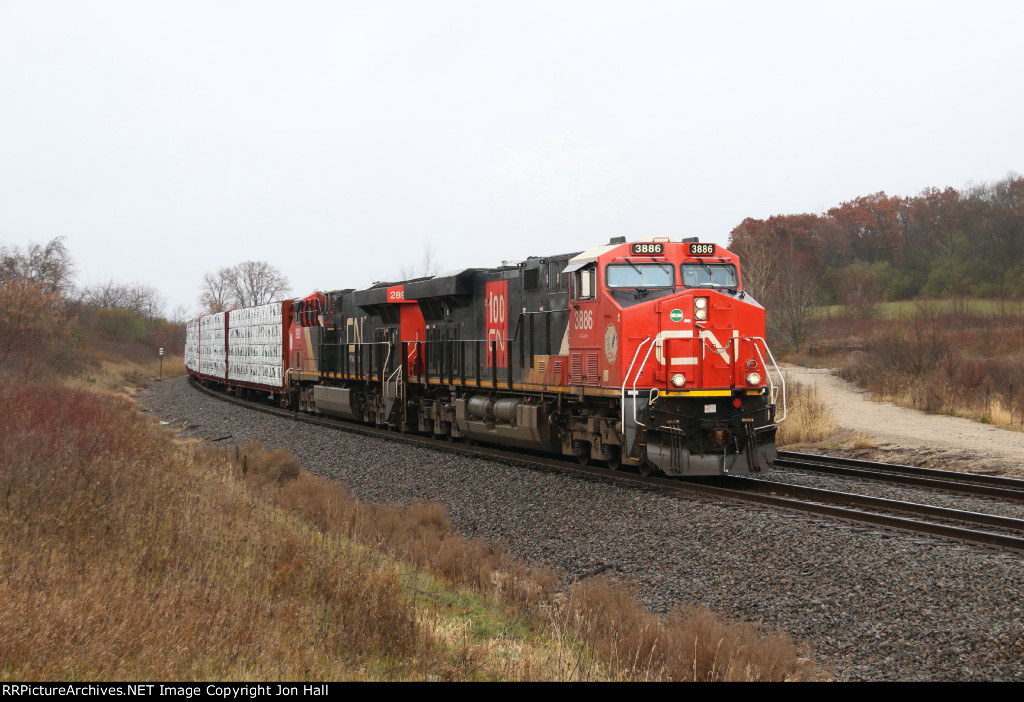 CN 3886 & 2892 work hard as the begin the climb up Byron Hill with X34241